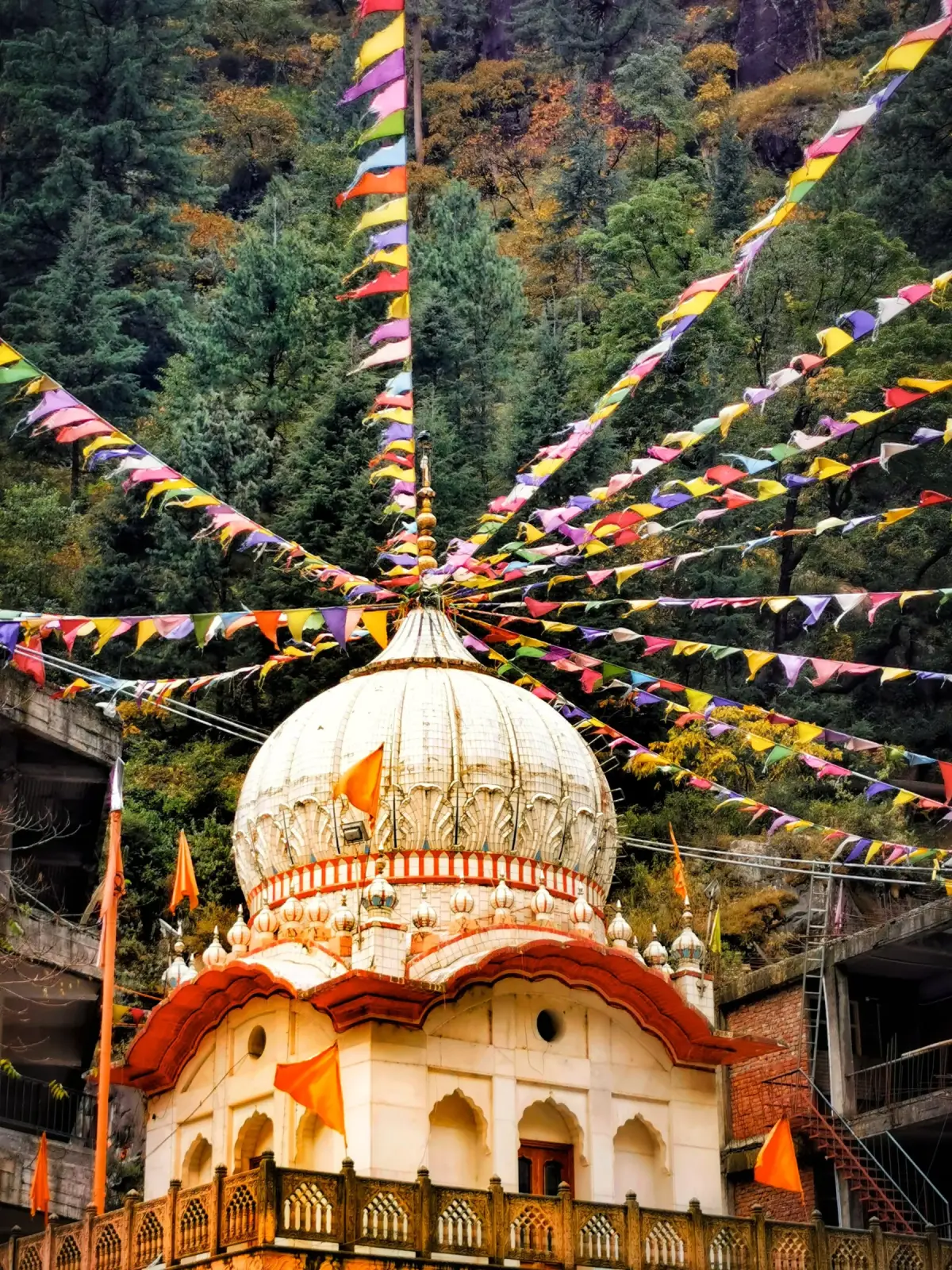 Temple and prayer flags on the mountain trail