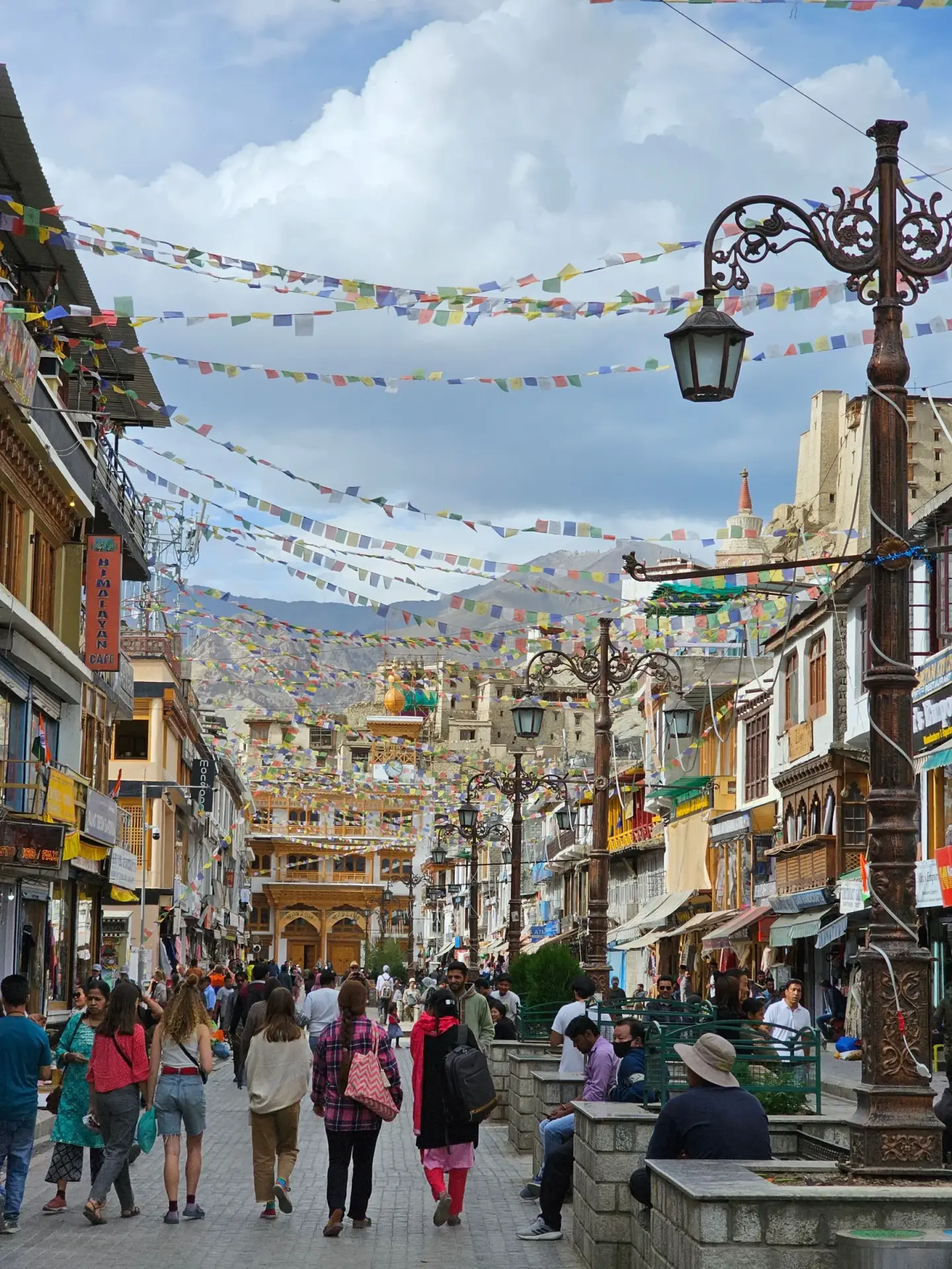 Prayer flags above a colourful Himalayan street
