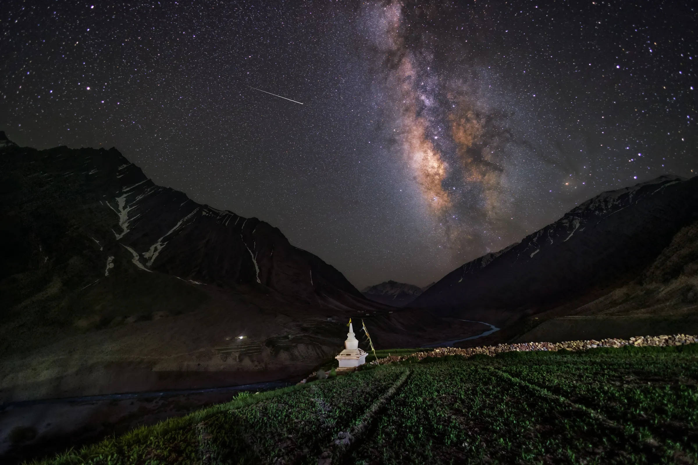 A quiet alpine camp beneath a star-filled sky